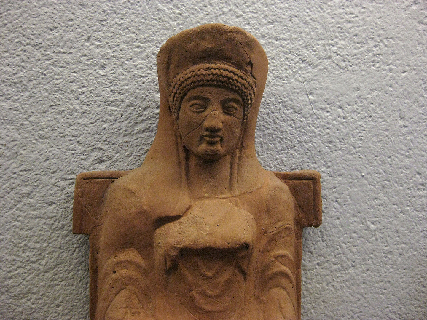 Terracotta votiefbeeldje, (Paestum, Itali); Votive terracotta, Paestum (Campania, Italy)